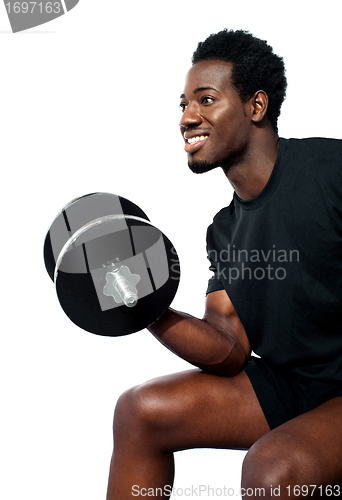 Image of Muscular man with dumbbell