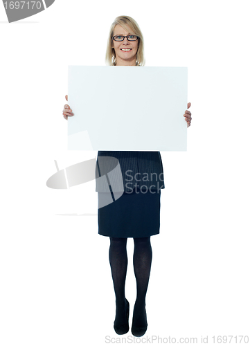 Image of Company secretary holding blank billboard