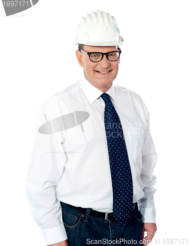 Image of Handsome smiling aged engineer with hard hat
