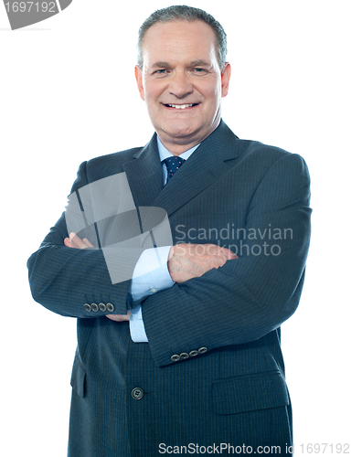 Image of Matured businessperson posing with crossed arms