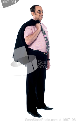 Image of Senior executive holding his coat over shoulders