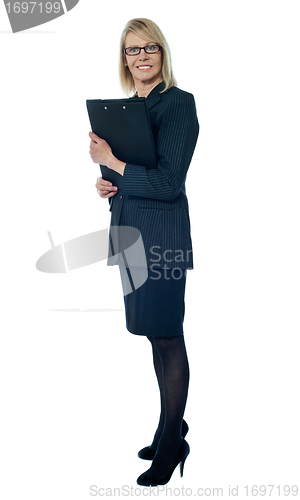 Image of Corporate woman holding business documents