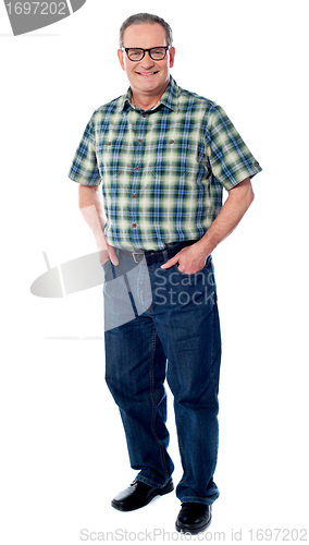 Image of Joyful senior man posing casually