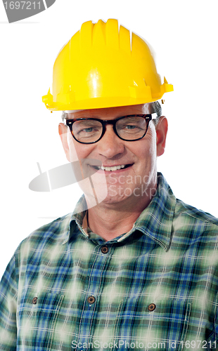 Image of Closeup of senior architect in hardhat, smiling