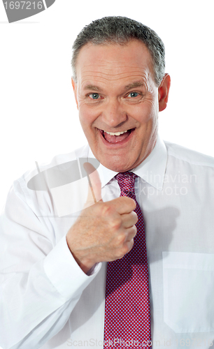 Image of Successful entrepreneur gesturing thumbs-up