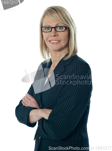 Image of Senior female manager posing with arms crossed
