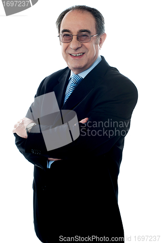 Image of Aged male employee posing in style