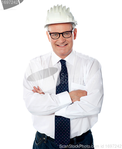 Image of Portrait of happy senior foreman with hard hat