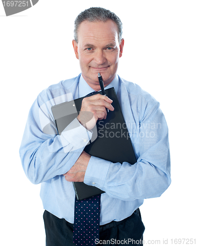Image of Businessman holding clipboard