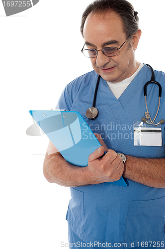 Image of Medical specialist studying report