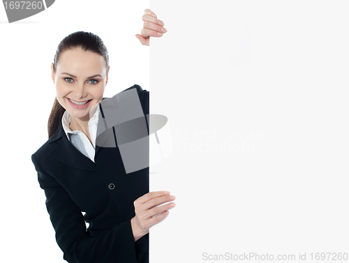 Image of Businesswoman holding a long banner ad