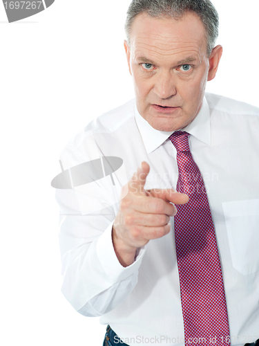 Image of Portrait of an angry middle aged businessman
