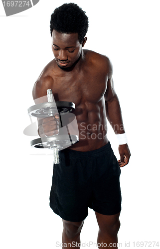 Image of Young man doing biceps excercise