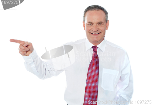 Image of Old caucasian male executive pointing away