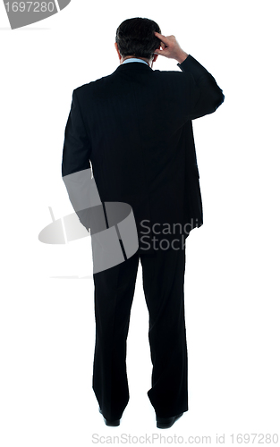 Image of Rear view of corporate person thinking