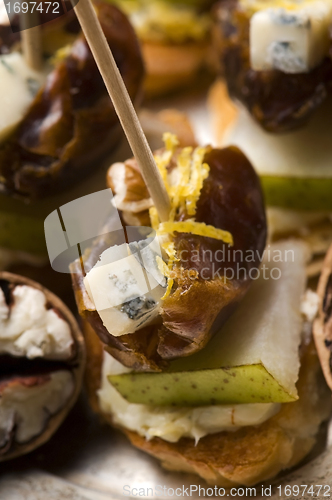 Image of Appetizer Plate with Dactyl, Pecan nuts and Cheese