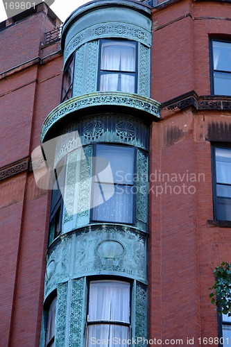 Image of ornate rounded bay windows one
