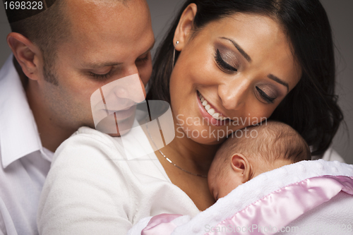 Image of Mixed Race Young Family with Newborn Baby