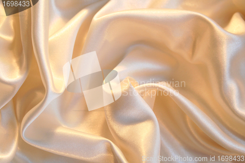 Image of Smooth elegant golden silk as background