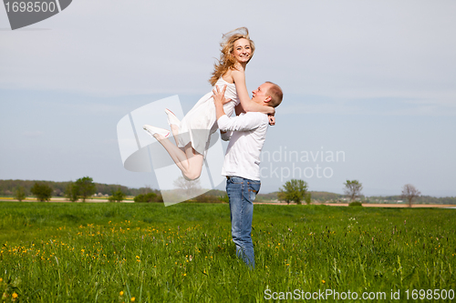 Image of young happy couple have fun in summer