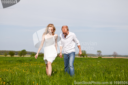 Image of young happy couple have fun in summer