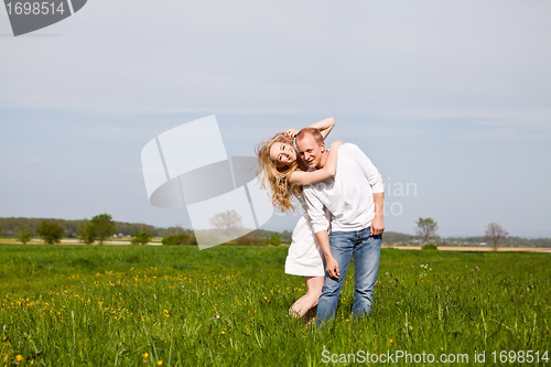 Image of young happy couple have fun in summer
