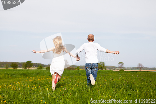 Image of young happy couple have fun in summer