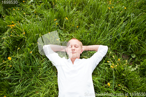 Image of young man outdoor in summer in nature happy