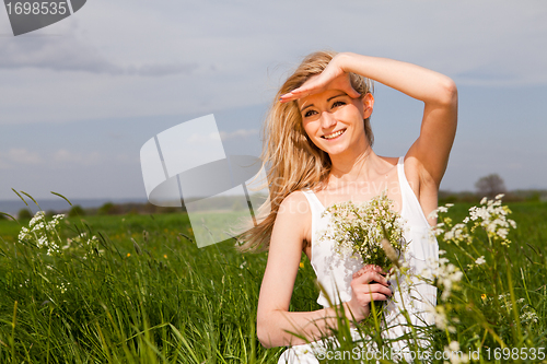 Image of beautiful blonde woman outdoor in summer happy