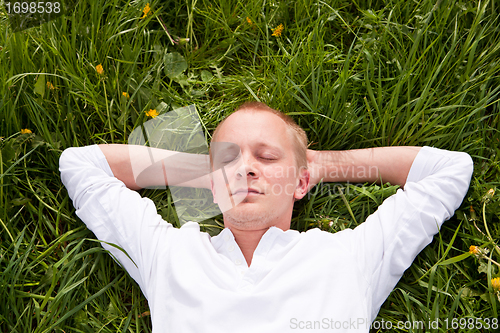 Image of young man outdoor in summer in nature happy