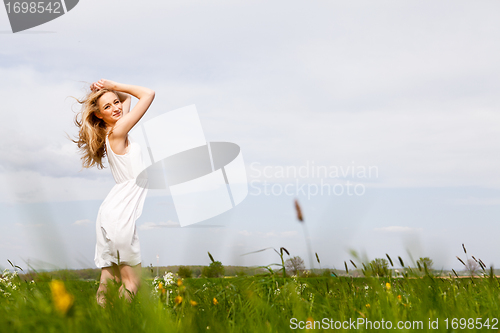 Image of beautiful blonde woman outdoor in summer happy