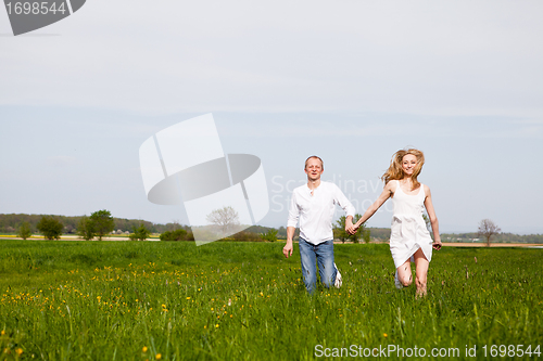 Image of young happy couple have fun in summer