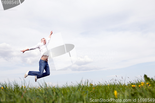 Image of young man outdoor in summer in nature happy