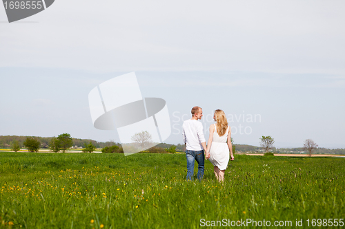Image of young happy couple have fun in summer