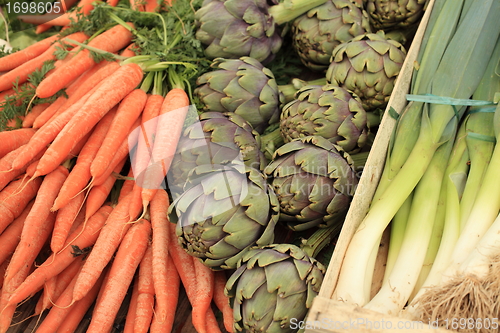 Image of leeks carrots artichokes in spring in a market