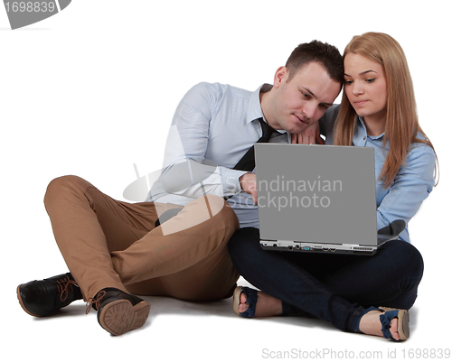 Image of Young couple working on a laptop