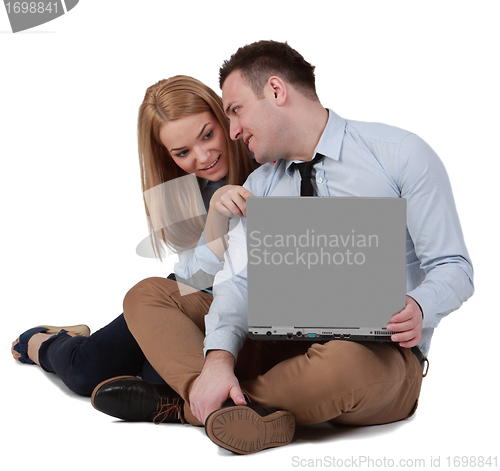 Image of Young couple working on a laptop