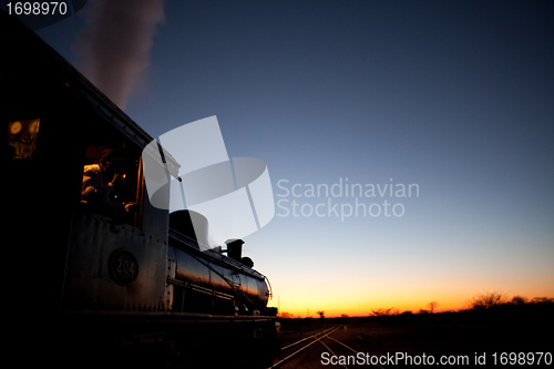 Image of Locomotive into sunset