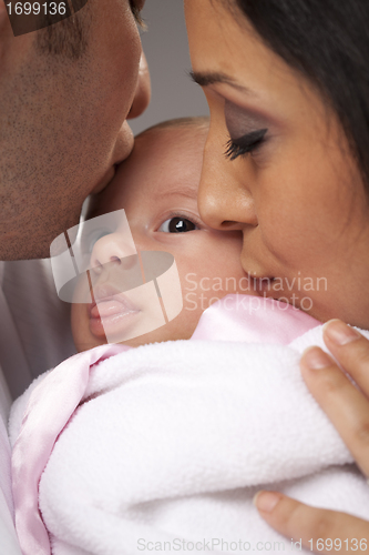 Image of Mixed Race Young Family with Newborn Baby