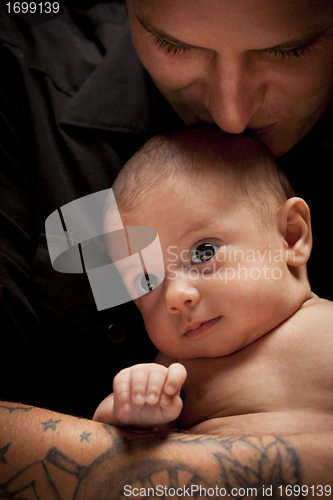 Image of Young Father Holding His Mixed Race Newborn Baby