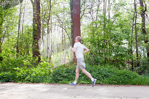 Image of man is jogging in the forest