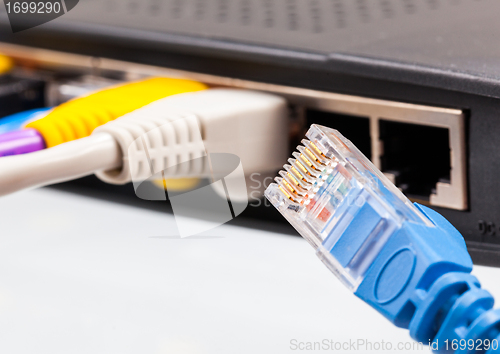 Image of Cat 5 cables in multiple colors in router