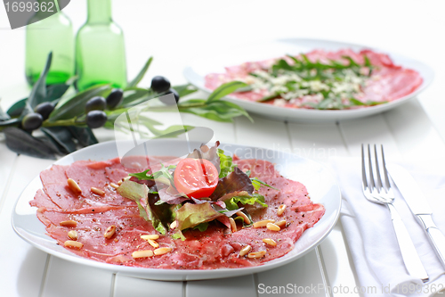 Image of Carpaccio with salad and pine nut