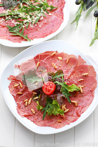 Image of Carpaccio with salad and pine nut