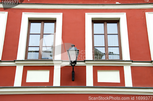 Image of Renovated ancient building wall and retro lamp 