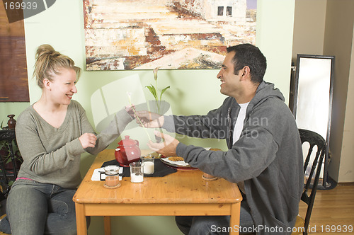 Image of man offering flower