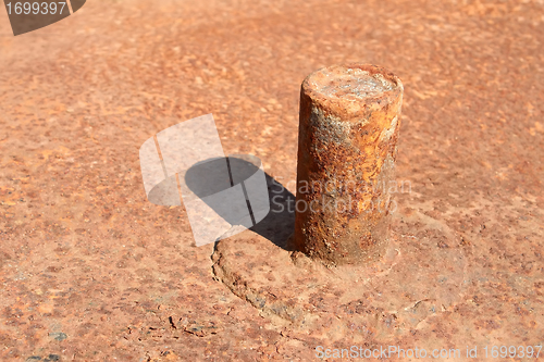 Image of Rusty pipe welded to platform