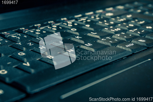 Image of close up of toned laptop keyboard
