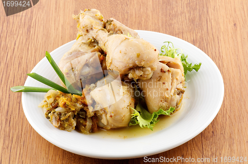 Image of Roasted chicken legs vegetables saute and greens