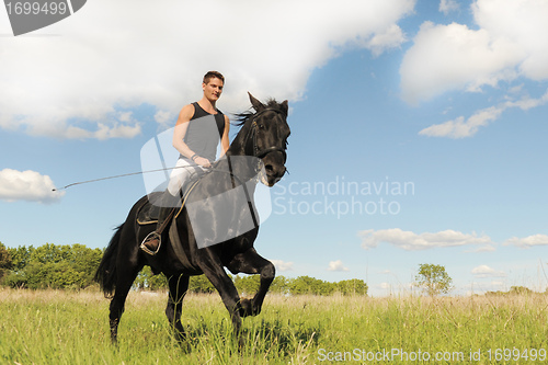 Image of young man and horse